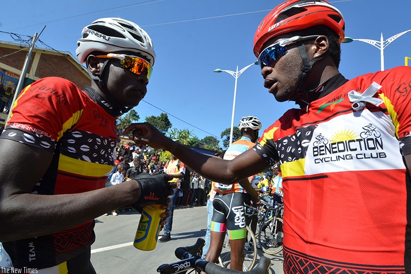 Uwizeyimana (right) chats with Club Benediction teammate Jean Bosco Nsengimana after winning the Race to Remember last weekend. (Sam Ngendahimana)