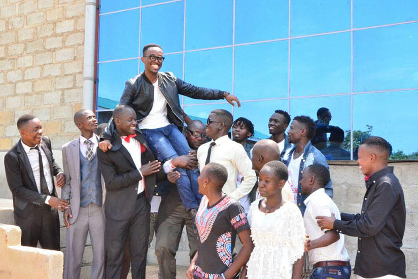 Roi G lifted up by his fans. / Courtesy 