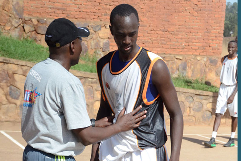 APR captain Parfait Ishimwe, right, listens to coach Cliff Owuor during a league game against 30-Plus last season. File photo
