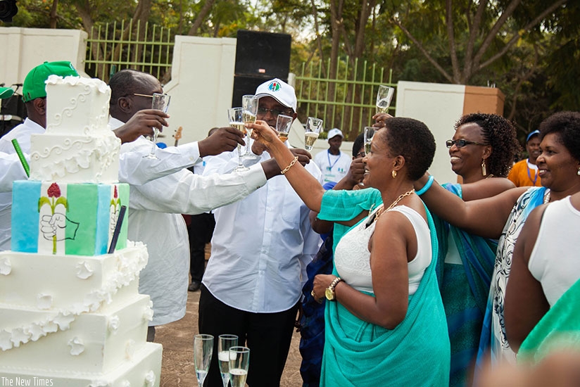 PSD President Vincent Biruta (C) and other party officials in a toast to celebrate PSD's 25th anniversary on Saturday. At the same event, the party endorsed President Kagame as the rightful candidate in the forthcoming presidential elections. Nadege Imbabazi.
