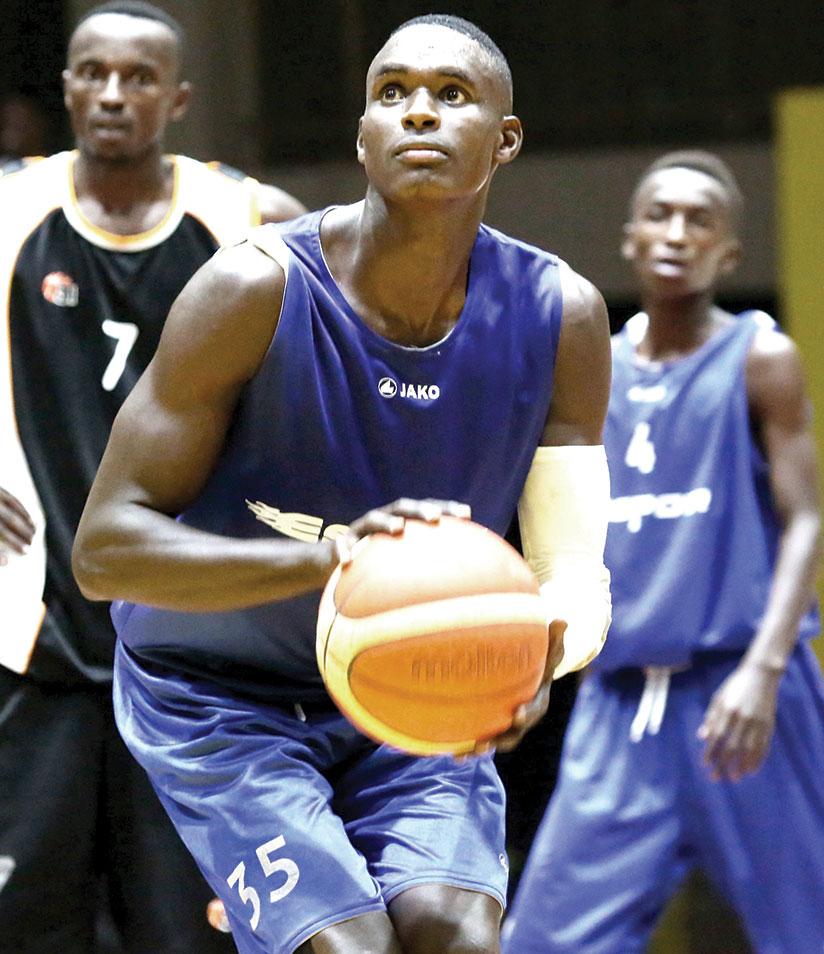 Pascal Niyonkuru, seen here preparing to take a free throw during a recent league game against APR, scored 17 points as Espoir beat REG to win the GMT. S. Ngendahimana