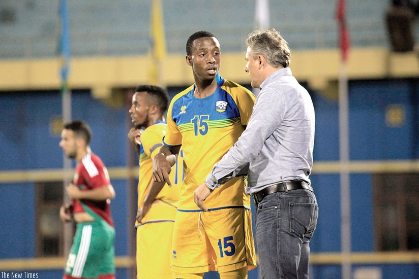 Hey gives instructions to defender Emery Bayisenge during the second half of the first game against Morocco on Friday. The coach has nemed a 19-player squad for next week's Afcon 2019 qualifier.