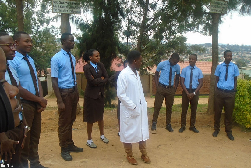 A teacher interacts with students. A teacher's dress code oc conductshould be exemplary to students.  (Photos by Lydia Atieno)