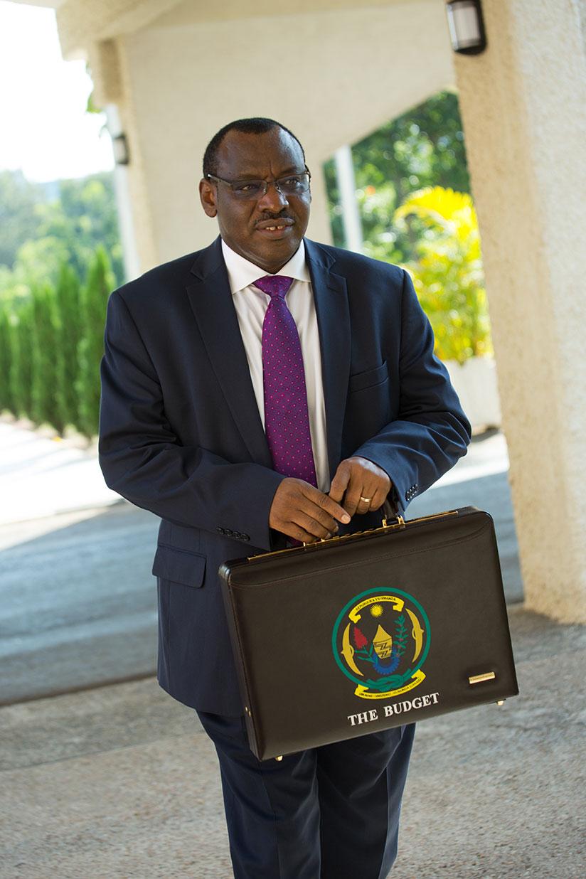 The Minister for Finance and Economic Planning, Claver Gatete, arrives at Parliament to present the 2017/2018 national budget. / Timothy Kisambira