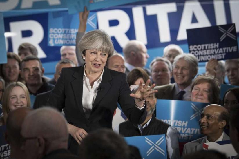 Britain's Prime Minister Theresa during campaigns