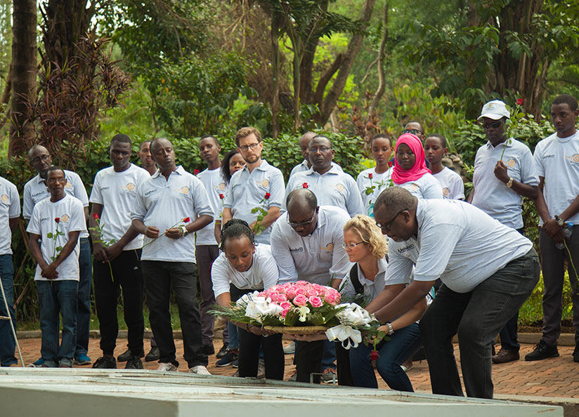 Rotarians lay a wreath at Kigali Genocide Memorial  yesterday. Nadege I