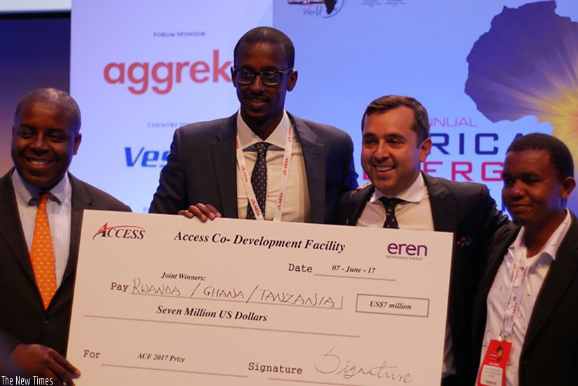 Contest winners receive a dummy checque for $7m from the organisers of the competition. Courtesy.