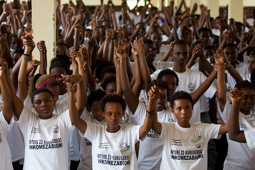 Youth join hands as a sign of solidarity during a civic education training at Gisozi last year. / File