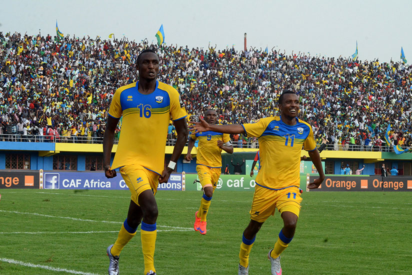 Ernest Sugira (L) celebrates with Amavubi teammates during a past game. He scored the consolation goal for the national team in Bangui yesterday. / File
