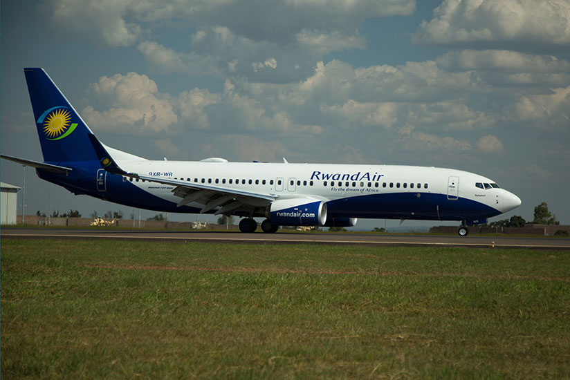 RwandAir's new Boeing 737-800 lands at Kigali International Airport. / Timothy Kisambira
