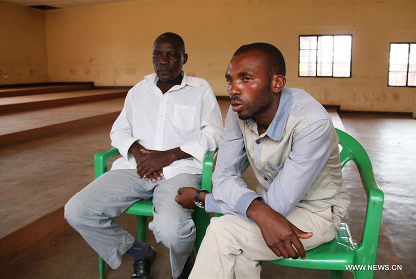 Rwamirindi (R) and Jean Marie Vianney Mudaheranwa during the interview in Kabarondo, Eastern Province, last week. / Xinhua