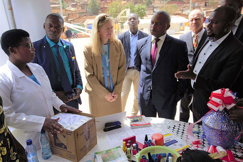 The US Ambassador to Rwanda, Erica Barks-Ruggles, and the Minister of State in charge of Technical and Vocational Education and Training, Olivier Rwamukwaya, during an exhibition of various courses that will be provided through Huguka Dukore project at the launch in Kigali yesterday. (Courtesy photos)