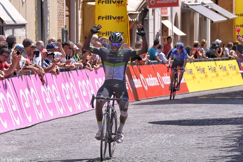 Joseph Areruya raises his arms in the air in celebration after winning stage five of Giro d'Italia yesterday. (Courtesy)