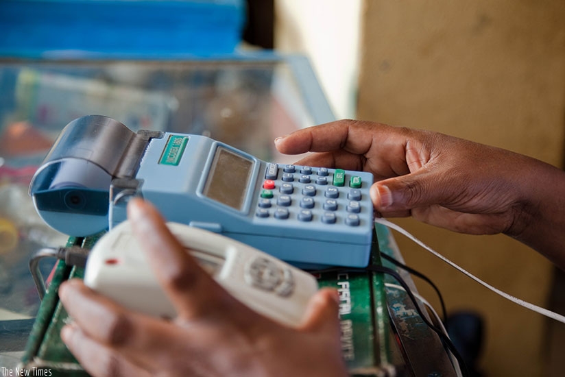 A businesswoman uses an EBM machine in a store. (File)