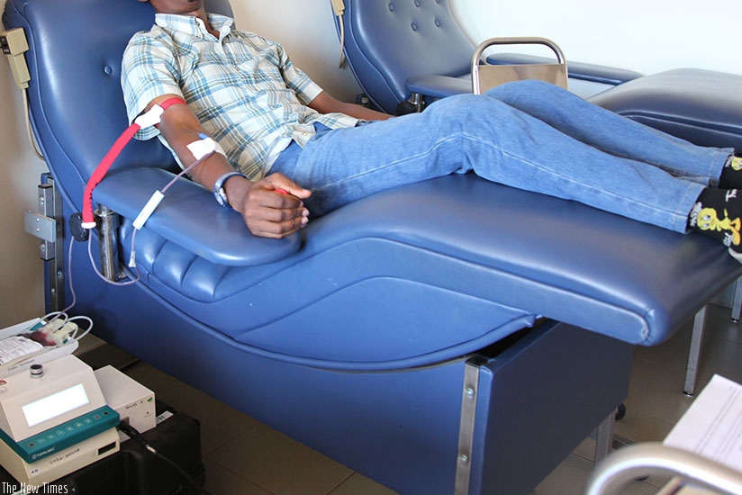 A man donates blood during a past blood donation awareness drive in Kigali. (File)