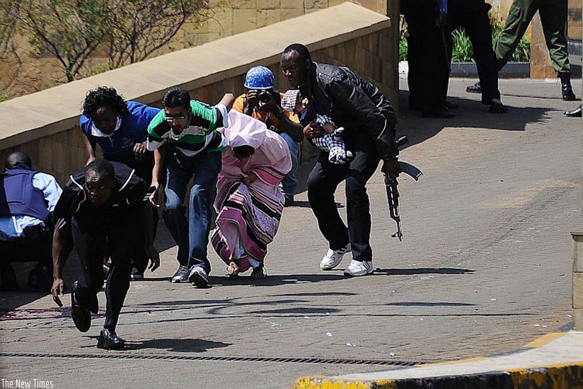 Police and security operatives lead hostages out of Westgate shopping mall in Nairobi during a terrorist attack in 2013. Net