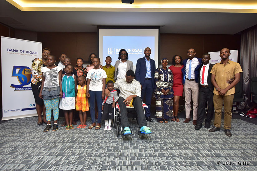 Winners of the Bank of Kigali MyWishAt50 pose for a photo with top officials of the bank including CEO Diane Karusisi. / Photos by Igihe