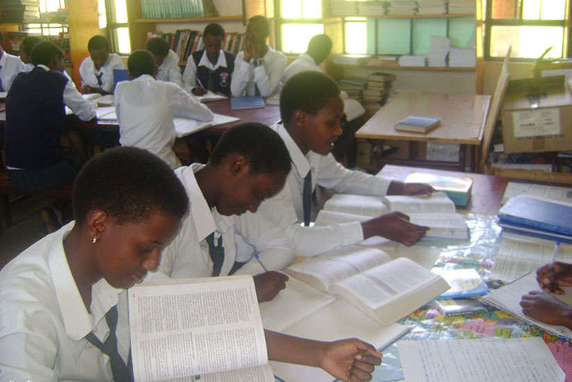 Students revise using textbooks. REB has recalled a textbook that trivialises Genocide. / File