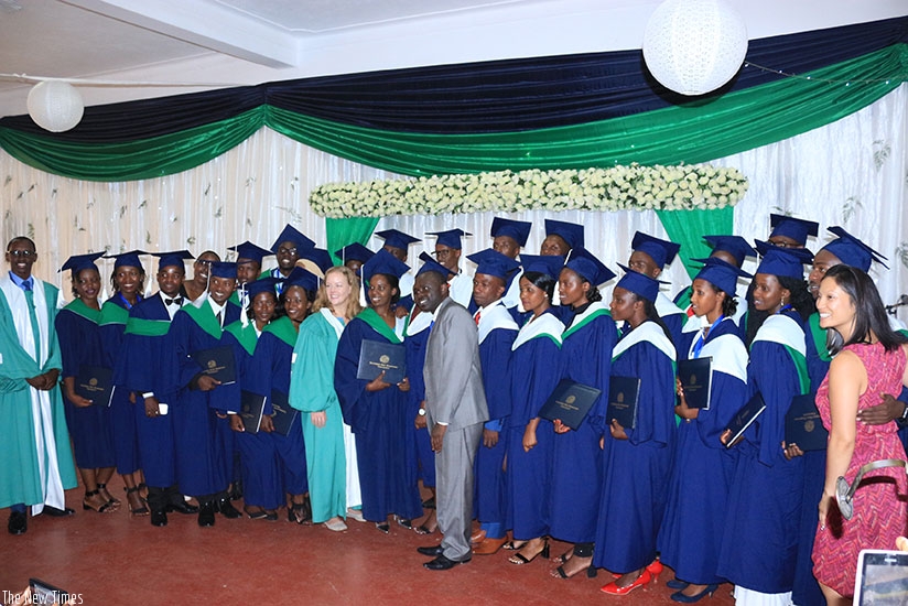 Graduates in a group photo with the guest of honour and university officials. 