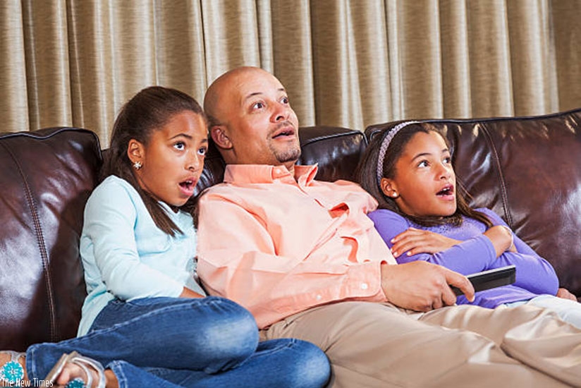 Watching TV and doing other things together as a family helps break the monotony that comes with curfews  (Net photo)