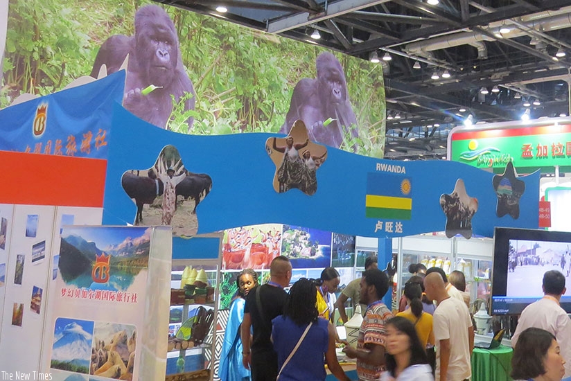 Visitors at Rwanda's stall at the Beijing tourism expo. (Richard Ruhimbana)