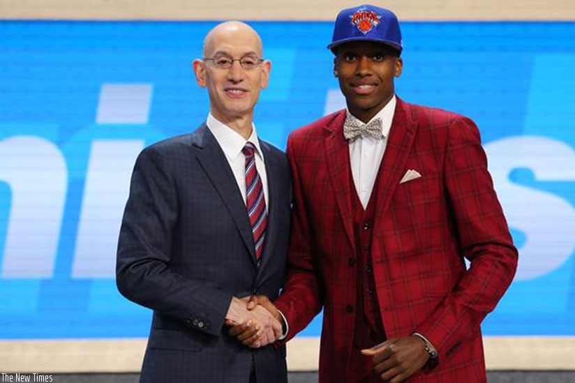 Frank Ntilikina (R) after he was drafted to the NBA (Net photo)