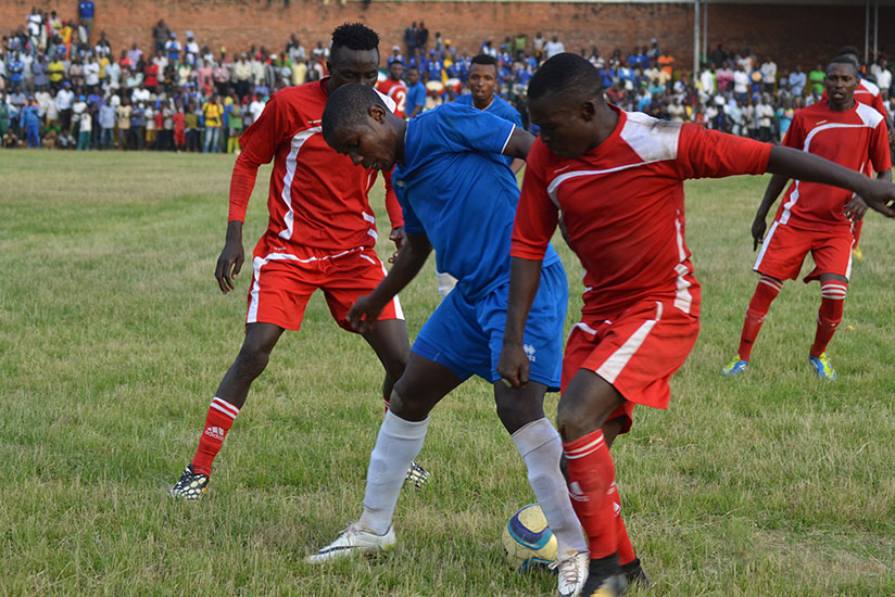 Rayon Sports striker Shassir Nahimana fights for the ball with Espoir players in a recent game at Kamarampaka stadium. / Sam Ngendahimana
