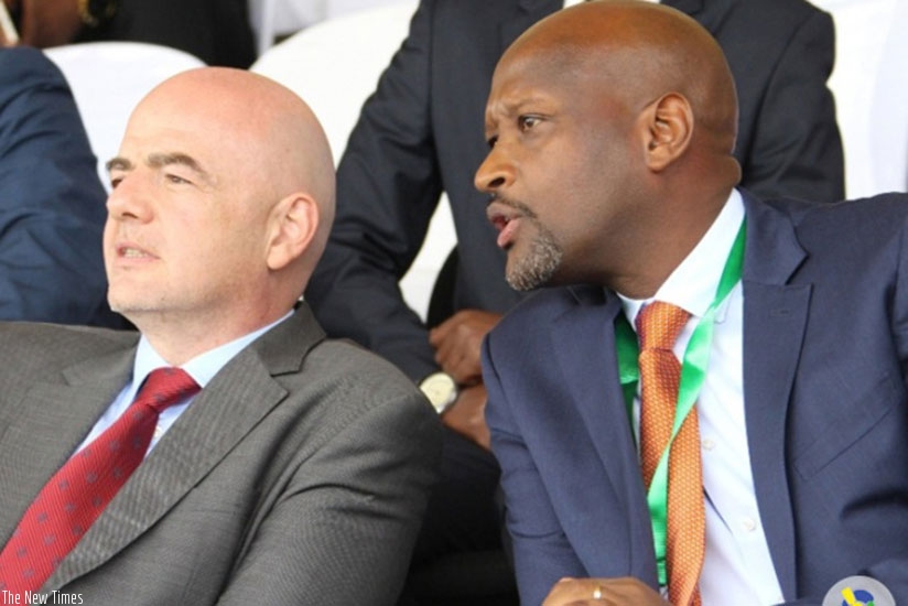 Nzamwita with FIFA boss Infantino when the latter visited Rwanda in February. File