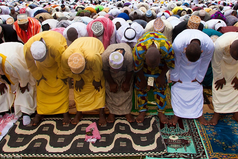 Muslims pray during Eid-el-Fitir prayers at Kigali Regional Stadium in Nyamirambo yesterday. T. Kisambira.