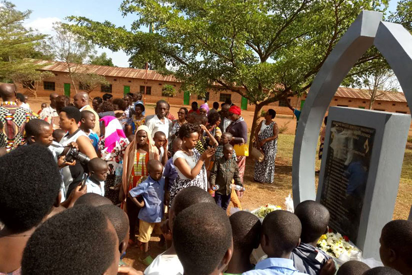 Rwamagana residents and students look at the monument of fallen teachers during commemoration event on Sunday. / Emmanuel Ntirenganya
