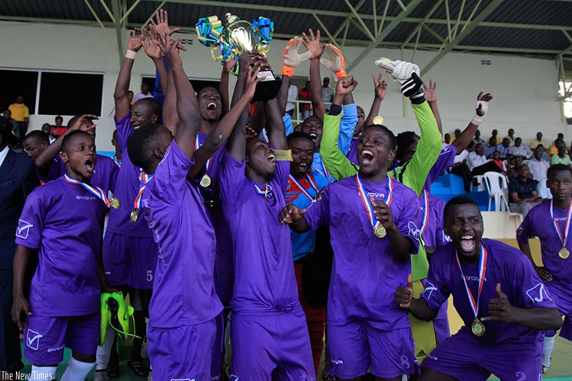 Miroplast FC players hold their trophy aloft after beating Isonga FC 2-0 on Monday. (Sam Ngendahimana)