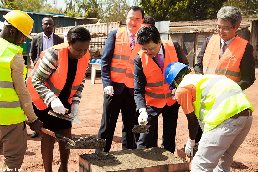 RDB's Akamanzi and Amb. Kim Eung Joong lay the foundation stone for the ICT Innovation centre in Kigali. (Nadege Imbabazi)