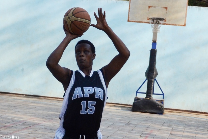 APR women basketball club captain Charlotte Umugwaneza tries a free-throw in a recent league match (Sam Ngendahimana)