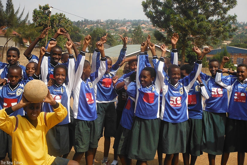 Passionate soccer fans and players of Kingdom Education Centre pose for a picture after a game. (All photos by Dennis Agaba)