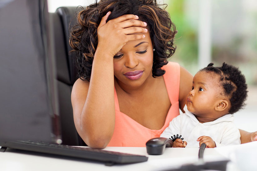 A working mother with her baby in office. Many men impregnate teenagers and fail to support them before and after giving birth, which affects both the mother's and child's wellbein....