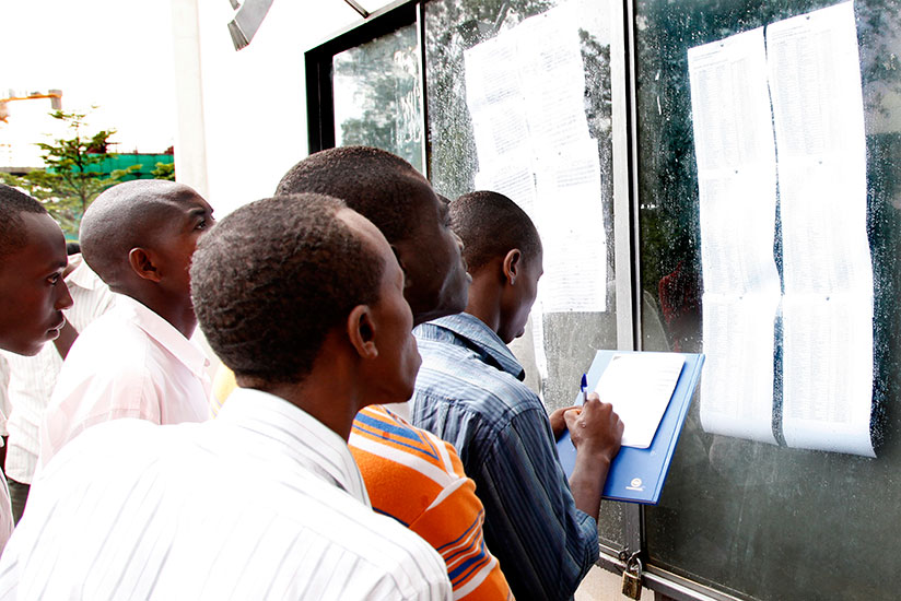 University of Rwanda students check their results on a notice board. / File