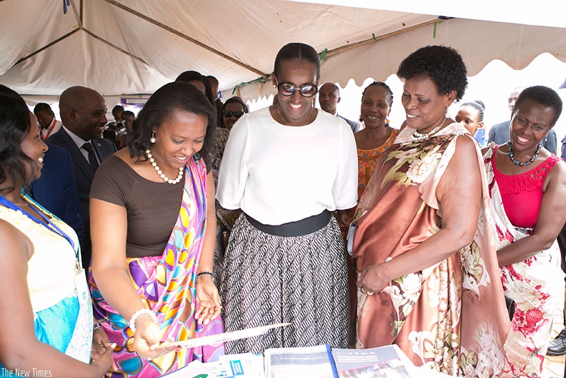 Mrs Kagame, Nyirasafari (to her right) and  Kanakuze (to her left) at Pro-Femmes Twese Hamweu2019s 25th anniversary celebration yesterday.rnrn