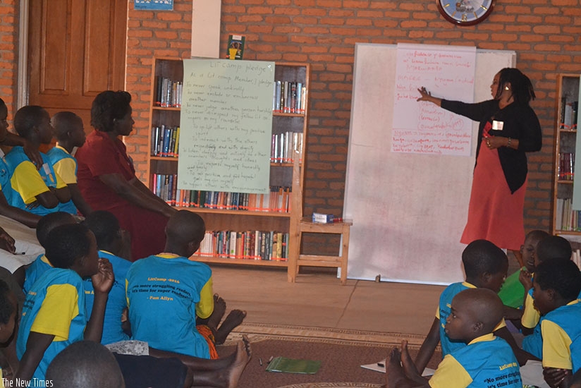 Students listen to a teacher in class. Parent's involvement in the child's activities at school boosts self-esteem and overall academic achievement.  (Photos by Lydia Atieno)