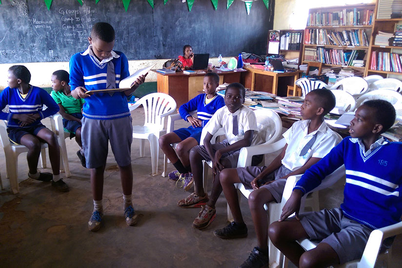 Reading aloud. A pupil reads out to his colleagues during a reading class. (All photos by Dennis Agaba)