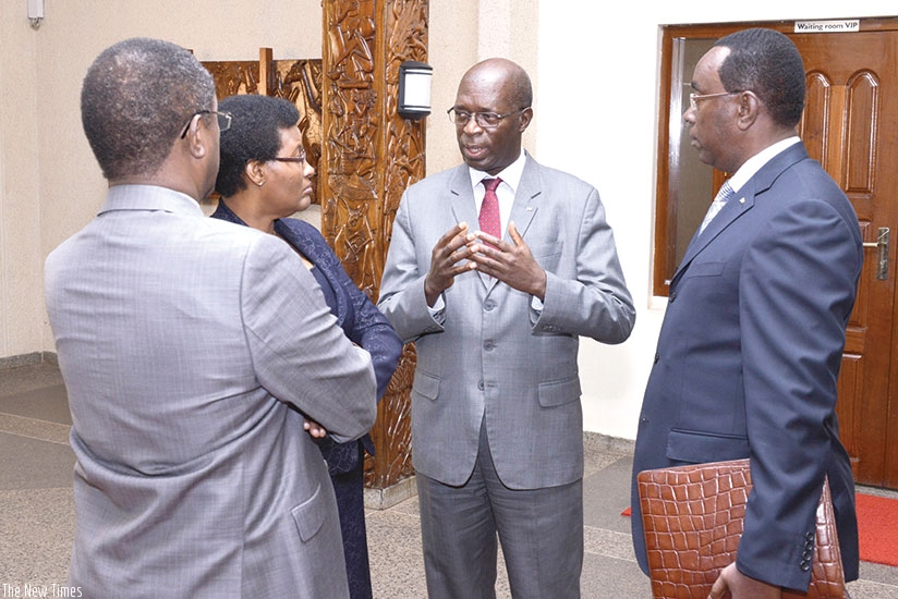 Prime Minister Anastase Murekezi chats with Speaker of the Chamber of Deputies Donatille Mukabalisa (2nd L), Natural Resources minister Vincent Biruta (L), and Senate president Ber....