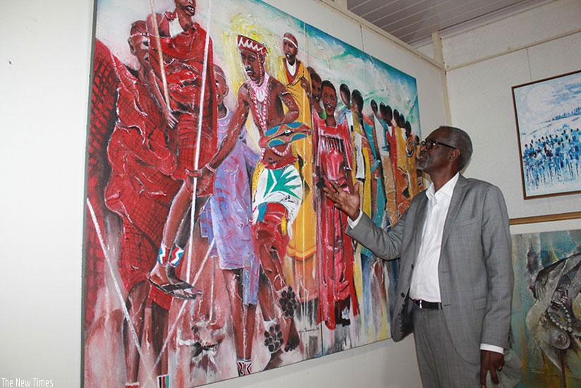 Renowned local visual artist Epa Binamungu shows off one of his paintings. (File)