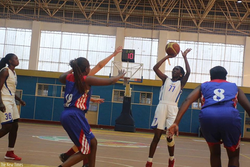 IPRC-South point guard Sandra Nelly Nsanzabaganwa shoots as Ubumwe players try to block her during the semi-finals two weeks ago at Amahoro Indoor Stadium. (Courtesy)