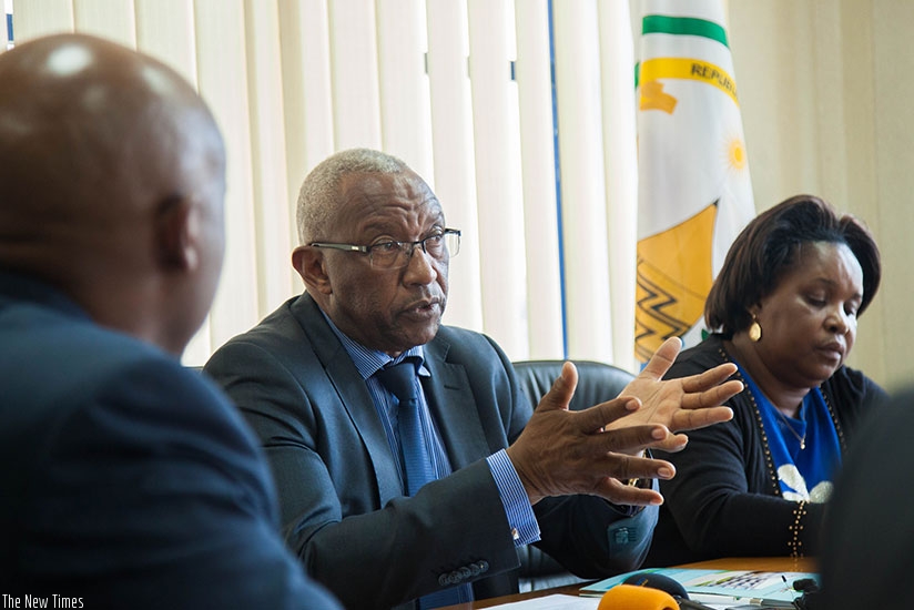 Mbanda addresses journalists yesterday. Right is NEC vice-chairperson Rosalie Mukamazera. N. Imbabazi.