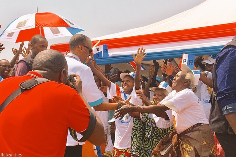 RPF flag-bearer, Paul Kagame greets supporters on his arrival at his first campaign rally that was held in Ruhango district earlier today. (Courtesy photo)