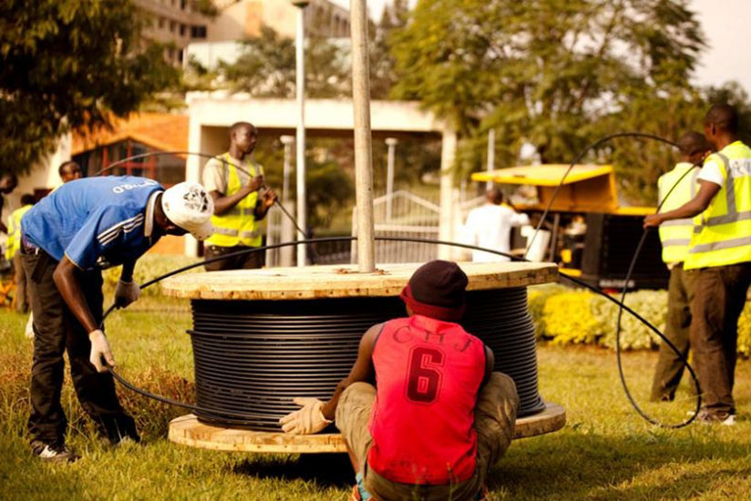 Workers installing cyber optic cables at Kimihurura in Kigali. / File
