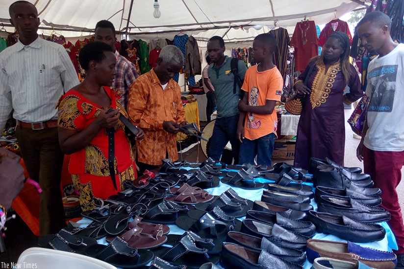 Showgoers admire shoes at a recent expo in Kigali. Rwanda is promoting consumption of local products to support industries and help reduce its growing import bill. / Apollonia Uwanziga.  