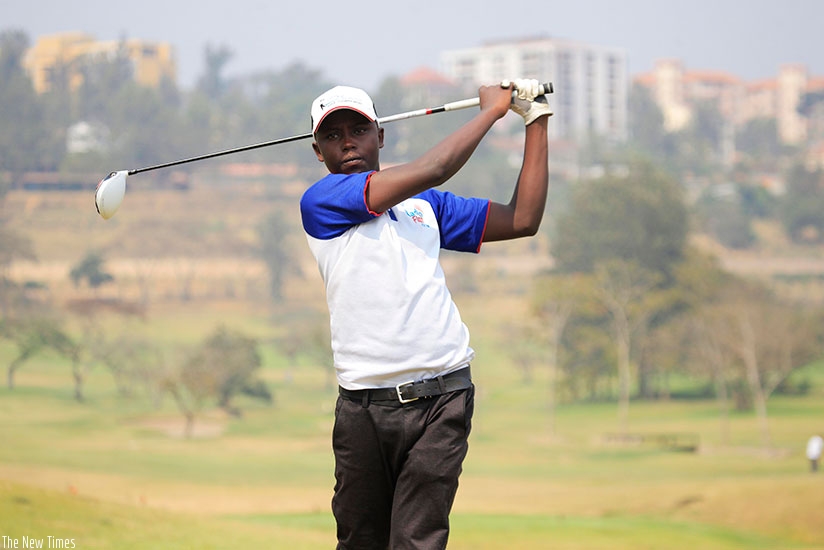 Rwanda's 19-year old number one amateur golf player, Aloys Nsabimana, trains at the Kigali golf course in Nyarutarama. / Sam Ngendahimana