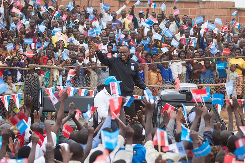 RPF-Inkotanyi Presidential candidate Paul Kagame waves to crowds at a rally in Muhanga District rnyesterday. Village Urugwiro.