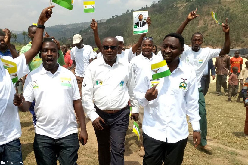 Habineza (R) and his task force arrive in Base Sector to address a rally yesterday. / Jean d'Amour Mbonyinshuti