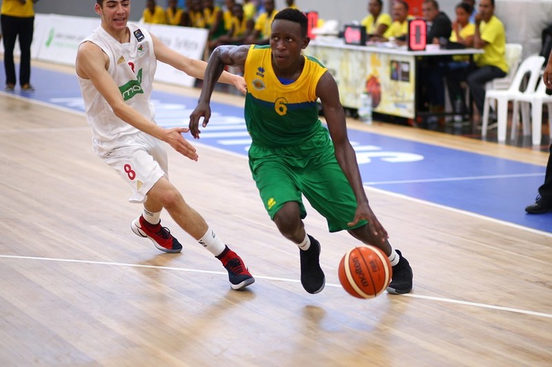 Rwanda's highly rated shooting guard Thierry Nkundwa dribbles past an Algerian player during the last group stage on Thursday in which he dropped a game high 16 points (courtesy)